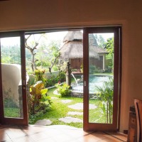 Main floor bedroom walkout to pool